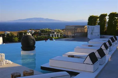 Poolside loungers facing the Aegean